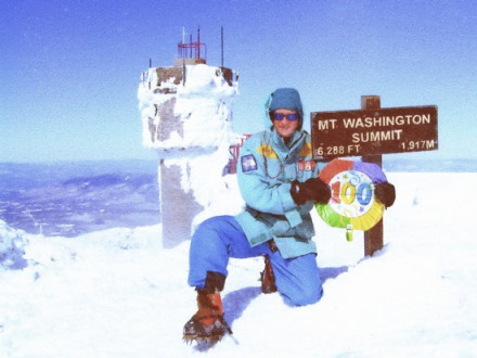 Peter Arsenault celebrates his 100th climb to the summit of Mount Washington.