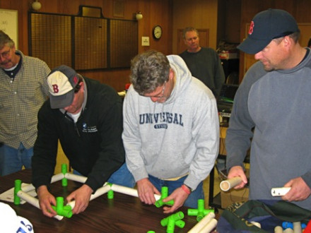 Local 29 members (l. to r.) Brian Cahill, Chris Haynes, Kevin Sharland, and Scott Burke participate in a “tubeworks” exercise as part of a Jan. 14-15 field leadership class.
