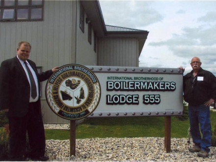 Local 555 BM-ST Dallas Rogers (l.) stands with his father, Doug, a retired Boilermaker and former lodge council member, outside the lodge’s newly-purchased union hall in Winnipeg.