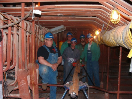 Local 85 members (l. to r.) Rick Babcock, Andy Brossia, Justin Betzer, and apprentices Jesse Green and Mike Schmitzer at DTE Energy’s Monroe, Mich., plant outage in March. They are prepping roof tubes for welding.  All photos courtesy of Dennis Barker.