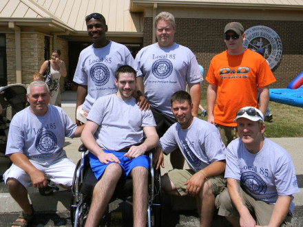 Dustin O’Shea enjoys support during a benefit July 9. First row, l. to r., appre