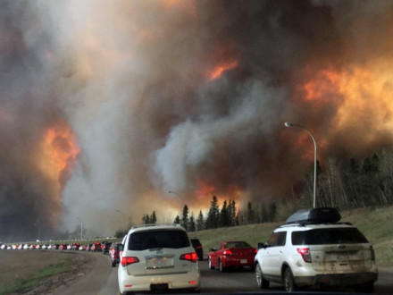 Fort McMurray residents evacuating along Highway 63 as the fire encroaches on the area.  Wikipedia/DarrenRD