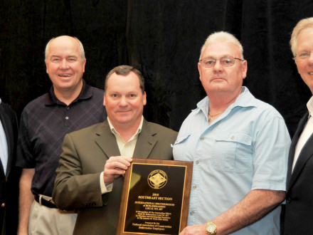 istrict 57 BM-ES Ed Vance, second from right, accepts the top NACBE safety award