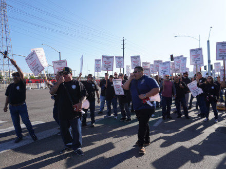 L-92 BM-ST Luis Miramontes (right, blue shirt) rallies Boilermakers in a practice picket outside the christening ceremony for the USNS Robert F. Kennedy at NASSCO shipyard.