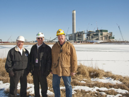 Standing in front of the massive new Prairie State Energy Campus power plant are, l. to r., Rick Eller, L-363 BM-ST; Mike Rother, PSGC director of contracts and industrial relations; and John Hoerner, L-363 member and Boilermaker general foreman.