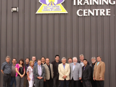 Staff and officers of the Quality Control Council of Canada stand in front of their new training centre for NDT workers in Edmonton, Alberta.