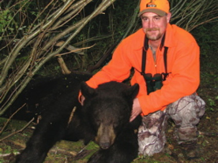 L-154’s Todd Crawford with the 300-pound bear he hunted on Escape to the Wild.