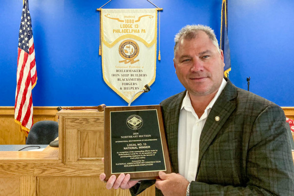 John Bland, BM-ST of Local 13, receives the John F. Erickson NACBE Safety Award on behalf of his lodge.