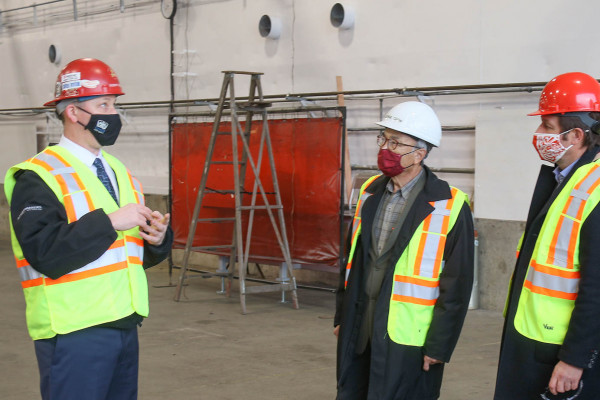 L to r: Robert Taylor, L-191 BM-ST, explains the fabrication shop at Victoria Shipyard to Hon. George Chow, Hon. Rob Fleming and MLA Andrew Mercier.