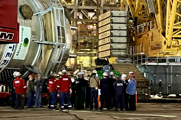 Boilermakers and other union workers gather for a pre-dawn meeting before the lift of the new reactor commences.