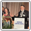 El Vicepresidente Internacional - Estados del Oeste, J. Tom Baca (en el podio) y el IR Tim Jefferies entregan a la senadora del estado de California, Nancy Skinner, un premio Boilermaker Riveter para honrar sus esfuerzos por respaldar la legislación que promueve el trabajo de los Boilermakers. El Vicepresidente Internacional - Estados del Oeste, J. Tom Baca (en el podio) y el IR Tim Jefferies entregan a la senadora del estado de California, Nancy Skinner, un premio Boilermaker Riveter para honrar sus esfuerzos por respaldar la legislación que promueve el trabajo de los Boilermakers.