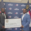 Carlos Brooks and Edwin Allen Jr. presented Senator Jon Ossoff with a $5,000 reelection campaign contribution on behalf of the Boilermakers union.