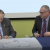 Bartlett Maritime Founder and CEO Edward L. Bartlett, Jr., left, and IP Warren Fairley sign the agreement.